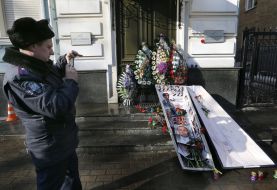 Militiaman near the coffin