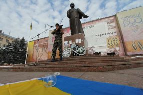 The fellow plays on an violin