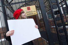 Participant of flash mob in support of the Russian TV channel