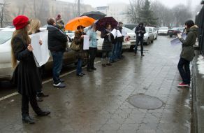 Participants of flash mob in support of the Russian TV channel
