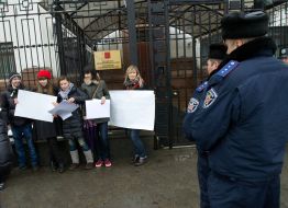 Participants of flash mob in support of the Russian TV channel