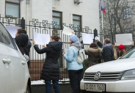 Participants of flash mob in support of the Russian TV channel