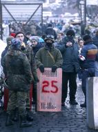 Protesters outside the metal gate