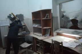 Protesters smash police car