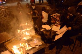 Protesters burn papers