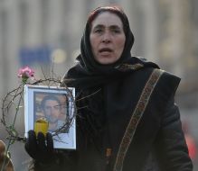 Women with the portraits of lost