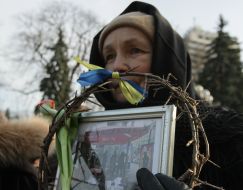 Women with the portraits of lost