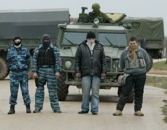 People with guns and hidden faces