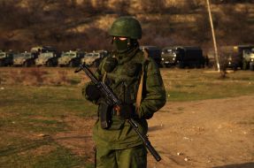 Soldier in camouflage with a gun