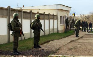 Servicemen block military unit