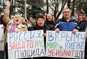 A man holding a plackard