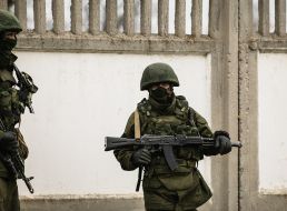Soldier in camouflage with a gun