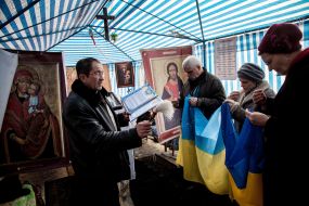 People pray in the prayer tent