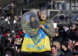 Woman holds Shevchenko's portrait