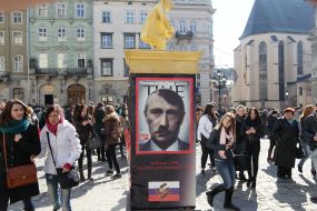 "A pillar of shame" with representing Vladimir Putin