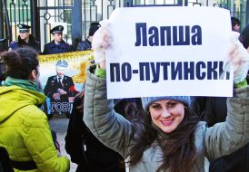 Activists hold placards