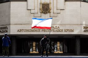 A man holding a flag of ARC