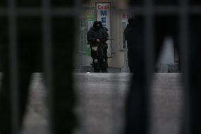 Unknown militarists with guns