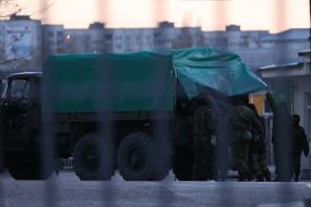 Unknown militarists with guns