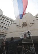 Signboard with the new name on building of parliament of Crimea