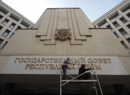 Signboard with the new name on building of parliament of Crimea