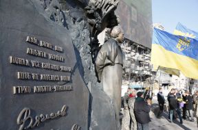 Laying flowers at the monument to Chornovol