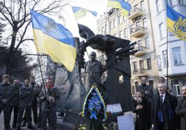 Laying flowers at the monument to Chornovol