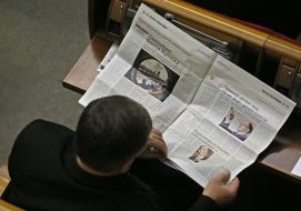 Deputy reading a newspaper
