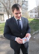 Young man holding a Russian passport