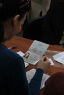A woman holds a Russian passport