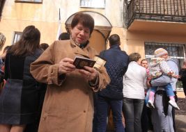 A woman holds a Russian passport