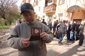 A man holds a Russian passport