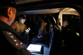 Militioner inspects auto of Oleg Tsarev