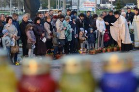 The priest blesses Easter baskets