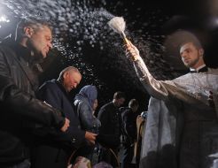 A priest conducts the rite of consecration