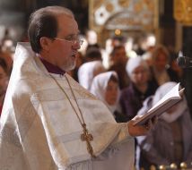 A priest conducts the rite of consecration