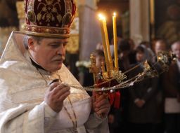 A priest conducts the rite of consecration