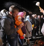A priest conducts the rite of consecration