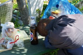 Man sleeping near the grave