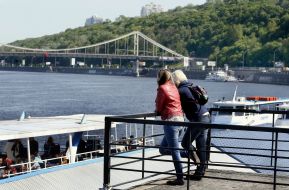 Girls stand on the waterfront