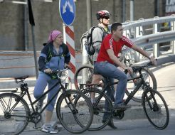 People ride bicycles