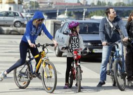 People ride bicycles