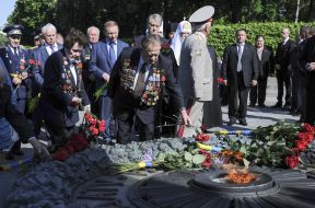 Participants of ceremony of laying-on of flowers