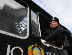 The driver in the cockpit of retro train