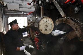 The driver in the cockpit of retro train