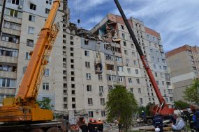 Evacuation of woman from brought down home