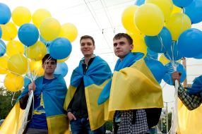 participants  of parade Ukrainian flags