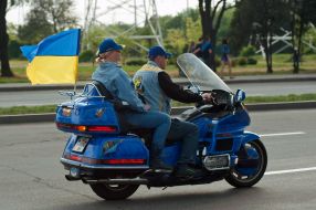participants  of parade Ukrainian flags
