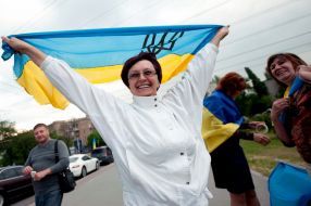 participants  of parade Ukrainian flags