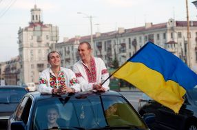 participants  of parade Ukrainian flags